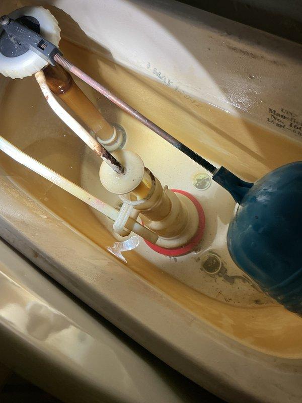 Responded to a water leak under the bathroom sink at the P-trap assembly. Upon inspection, identified a loose drain stopper nut causing water to drip when the sink was in use. Tightened the drain stopper assembly to stop the leak and verified proper seal. During the service visit, also inspected the basement toilet that was reported to be constantly running. Examined the flush valve assembly, flapper seal, and fill valve mechanism inside the tank. Documented existing conditions including mineral deposits and wear on internal components. Adjusted the fill valve and flush mechanism to resolve the continuous running water issue. Both plumbing concerns were addressed and tested for proper operation before completing the service call.