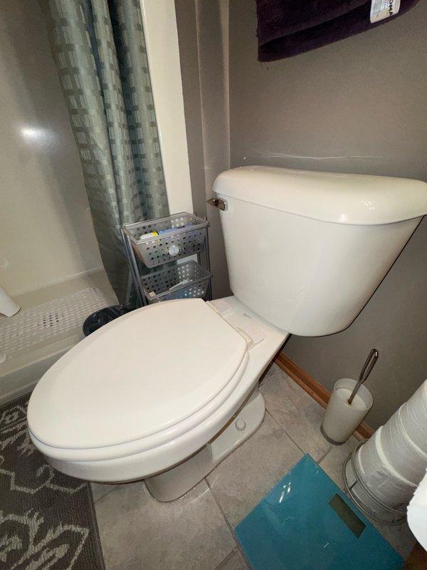 Responded to a leaking toilet at the base that occurred during flushing. Upon inspection, removed the toilet from the floor and discovered the existing wax ring had deteriorated and washed out completely. The toilet flange was found to be level with the finished floor surface, which contributed to the seal failure. Installed a flange spacer to achieve proper height clearance, then fitted a new wax ring to create a watertight seal between the toilet base and the drain flange. Reinstalled and secured the toilet to restore proper function and eliminate the leak.