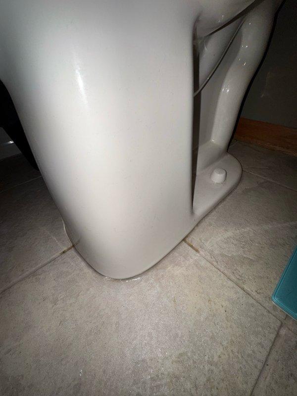 Responded to a leaking toilet at the base that occurred during flushing. Upon inspection, removed the toilet from the floor and discovered the existing wax ring had deteriorated and washed out completely. The toilet flange was found to be level with the finished floor surface, which contributed to the seal failure. Installed a flange spacer to achieve proper height clearance, then fitted a new wax ring to create a watertight seal between the toilet base and the drain flange. Reinstalled and secured the toilet to restore proper function and eliminate the leak.