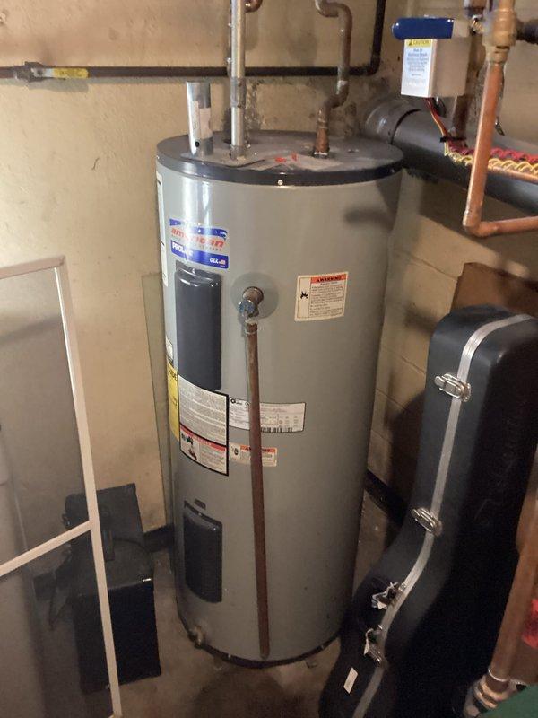 Responded to service call for inconsistent hot water delivery from electric water heater. Upon inspection, identified improperly configured thermostats with mismatched temperature settings between upper and lower elements. Corrected thermostat settings to manufacturer specifications, ensuring both units operate at consistent temperatures for optimal hot water production. Additionally observed developing leak at outlet piping connection that will require future attention, though heating elements tested functional at time of service.