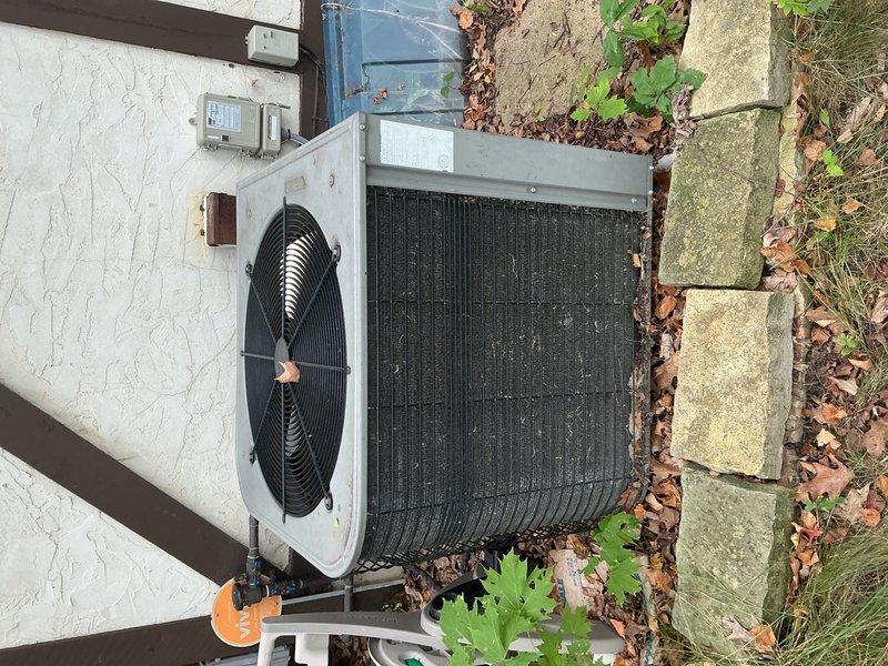 Responded to no cooling complaint on 21-year-old residential AC system with repeated breaker tripping issues. This was the fifth service visit in one week for intermittent cooling failures. Previous technician had cleaned outdoor coils, verified refrigerant charge, tested capacitors, and inspected wiring with temporary success before unit failed again that evening.

Upon arrival, confirmed indoor blower motor operational with no error codes on furnace control board. Breaker was in ON position but outdoor unit remained off. Verified 24VAC present from thermostat to contactor. Tested capacitor - readings within acceptable range. Contactor showed no visible signs of failure or pitting.

Proceeded to electrical disconnect at outdoor unit. Found disconnect switch in ON position but measured zero 240VAC at load side terminals. Opened disconnect enclosure for inspection and identified severely corroded connection screw that prevented proper electrical contact. Screw deterioration was advanced