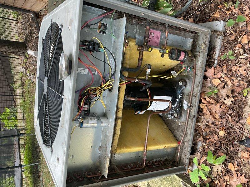 Responded to no cooling complaint on 21-year-old residential AC system with repeated breaker tripping issues. This was the fifth service visit in one week for intermittent cooling failures. Previous technician had cleaned outdoor coils, verified refrigerant charge, tested capacitors, and inspected wiring with temporary success before unit failed again that evening.

Upon arrival, confirmed indoor blower motor operational with no error codes on furnace control board. Breaker was in ON position but outdoor unit remained off. Verified 24VAC present from thermostat to contactor. Tested capacitor - readings within acceptable range. Contactor showed no visible signs of failure or pitting.

Proceeded to electrical disconnect at outdoor unit. Found disconnect switch in ON position but measured zero 240VAC at load side terminals. Opened disconnect enclosure for inspection and identified severely corroded connection screw that prevented proper electrical contact. Screw deterioration was advanced