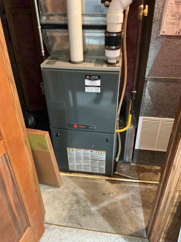 Responded to no cooling complaint on aging residential air conditioning system. Upon inspection, found evaporator coil beginning to freeze during operation, indicating low refrigerant charge. Added 1 lb of R-410A refrigerant to system and verified proper operation before departure.