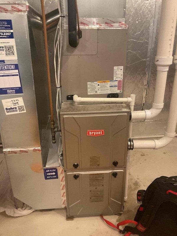 Responded to no cooling complaint with water pooling around furnace area. Found clogged condensate drain line causing water to back up and leak onto basement floor near HVAC equipment. Cleared obstruction from drain line, restored proper drainage flow, and verified system operation. Unit returned to normal cooling function with no further leakage observed.