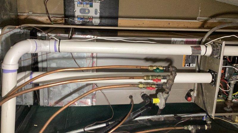 Performed comprehensive cooling system evaluation on dual-zone residential air conditioning system. South Side unit operational with failed zone damper motor identified and condensate pump overflow resolved; pump restored to working condition. Completed full system inspection including evaporator coil, blower assembly, air filter, condenser unit, contactor, compressor, and refrigerant levels. Cleaned condenser coil and verified all components and controls.

North Side unit found inoperative due to failed blower motor ECM requiring replacement. Blower wheel requires cleaning. Evaporator coil exhibited ice buildup resulting from blower failure. Inspected condenser, capacitor, contactor, and compressor; cleaned condenser coil. Unable to verify refrigerant levels due to system shutdown. Identified second failed zone damper motor on this unit requiring replacement.

Provided repair estimate for ECM blower motor replacement, blower wheel cleaning, and replacement of two zone damper motors ac