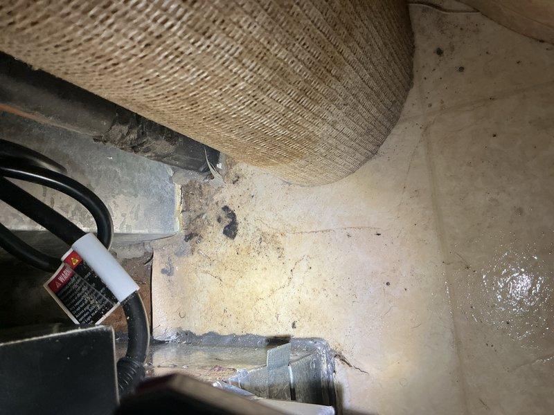 Responded to warranty call for newly installed AC system experiencing water leakage in furnace room and evaporator coil freezing. Upon arrival, found frozen evaporator coil with water draining from furnace onto floor, causing damage to flooring and surrounding area. Allowed coil to thaw completely before proceeding with diagnostics. Replaced dirty/incorrect air filter that was restricting airflow and contributing to freeze-up condition. Performed comprehensive system inspection including blower assembly, evaporator coil, TXV operation, and thermostat settings. Adjusted blower fan speeds to optimize airflow across evaporator coil. Verified refrigerant charge levels and pressures within manufacturer specifications. Cycled system through complete cooling operation and confirmed proper function with no freezing or water leakage. System returned to normal operation with adequate airflow and proper drainage.