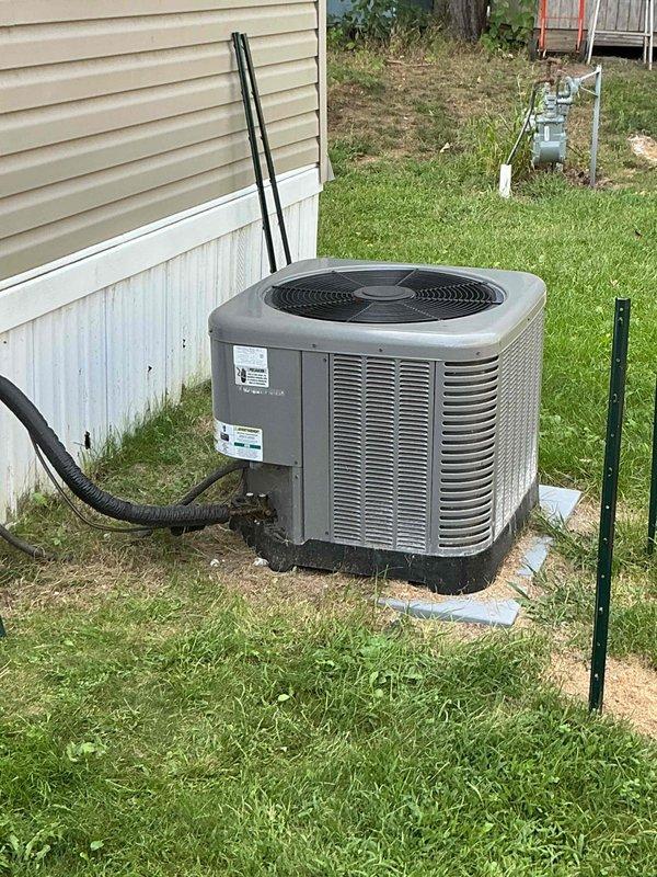 Responded to callback for 4-year-old residential AC system with no cooling and intermittent loud screeching noise. Upon arrival, discovered system would not power on due to burned wire at condenser unit. Repaired damaged electrical connection and restored power to unit. Conducted operational testing and monitored system performance while investigating previously reported squealing noise that occurs during shutdown and idle periods. Observed system experiencing pressure equalization issues when compressor cycles off, indicating potential thermostatic expansion valve malfunction. Verified amperage draw at 6.33A during operation. System currently operational but requires TXV replacement to resolve pressure equalization concern and eliminate screeching noise during shutdown cycles.
