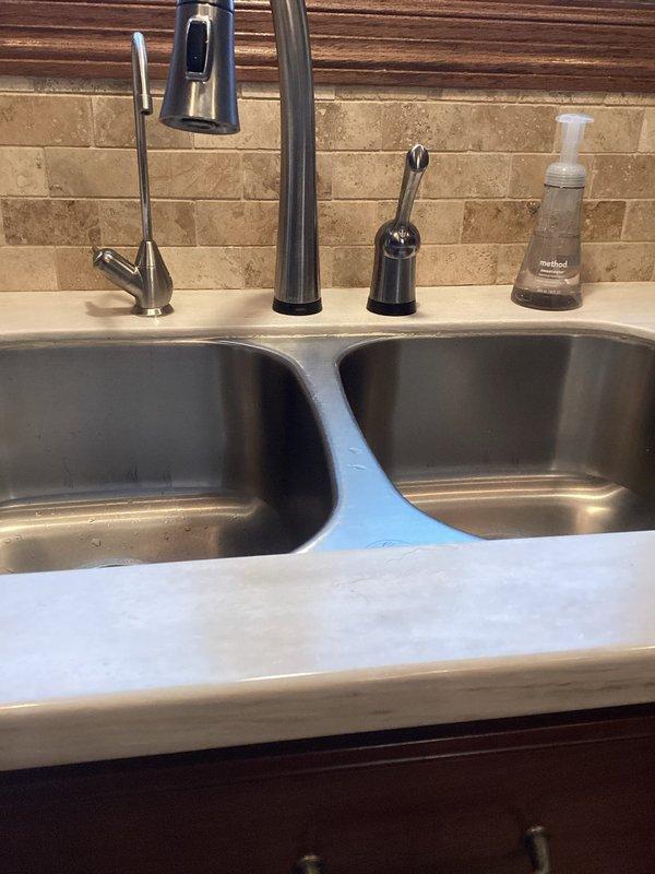 Removed solenoid assembly from kitchen faucet and installed adapter to convert unit to standard configuration using customer-supplied parts. Upon receipt of correct adapter component, completed installation and verified proper operation of faucet system with all water supply connections secure.