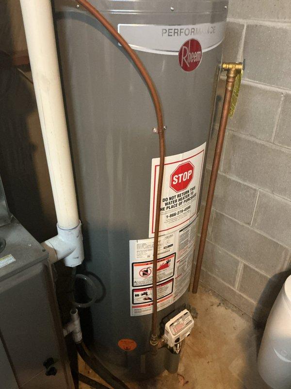 Responded to no-cooling complaint on 11-year-old AC system with loud buzzing and intermittent high-pitched whistling sounds. Diagnosed system as critically low on refrigerant, causing indoor evaporator coil to freeze and restrict airflow, which produced the reported whistling noise. Confirmed no damage to furnace from ice melt at time of inspection. Identified refrigerant leak present in system requiring leak search and repair. Presented repair options to customer and scheduled same-day estimate for complete AC replacement due to age and condition of existing unit.