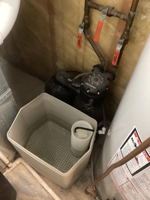 Completed comprehensive plumbing inspection of residential property, identifying inoperable sump pump in basement utility area. Removed failed sump pump unit and installed replacement pump with proper drainage basin configuration. Verified all plumbing connections, water treatment equipment, and associated piping systems for proper operation following sump pump replacement.