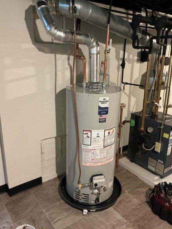 Responded to report of ceiling leak below bathroom in 1950s-era home. Upon inspection, identified leaking bathtub as source of water damage. Diagnosed faulty tub spout and shower cartridge as root cause of leak. Removed and replaced defective tub spout and cartridge with new components, restoring proper function and eliminating leak.