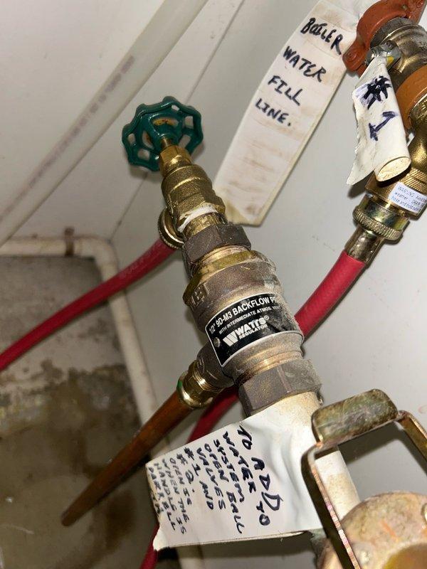 Completed annual heating maintenance on a residential boiler system. Performed comprehensive tune-up inspection including thermostat operation, blower assembly, burner/heat exchanger compartment, inducer operation, ignition system, flame igniter, safety controls, electrical components, and temperature rise verification. All readings were within normal operating range and system is operating properly. Identified backflow preventer leaking water on the boiler water fill line, which has been leaking since installation. Submitted parts form for backflow preventer replacement.