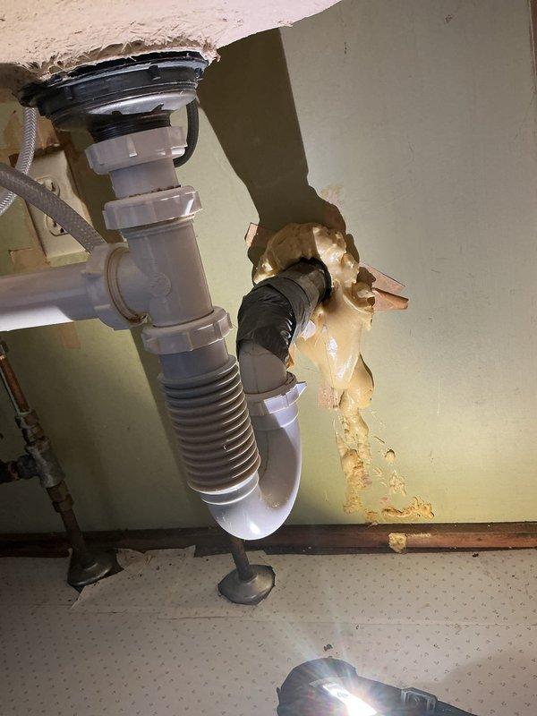 Responded to service call for leaking kitchen faucet replacement. Successfully removed existing 10+ year old faucet and installed homeowner-supplied replacement unit, restoring full functionality. During inspection, identified deteriorated supply lines and drain assembly with evidence of previous water damage and temporary repairs, but customer declined recommended repipe work under sink at this time.