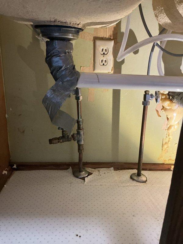 Responded to service call for leaking kitchen faucet replacement. Successfully removed existing 10+ year old faucet and installed homeowner-supplied replacement unit, restoring full functionality. During inspection, identified deteriorated supply lines and drain assembly with evidence of previous water damage and temporary repairs, but customer declined recommended repipe work under sink at this time.