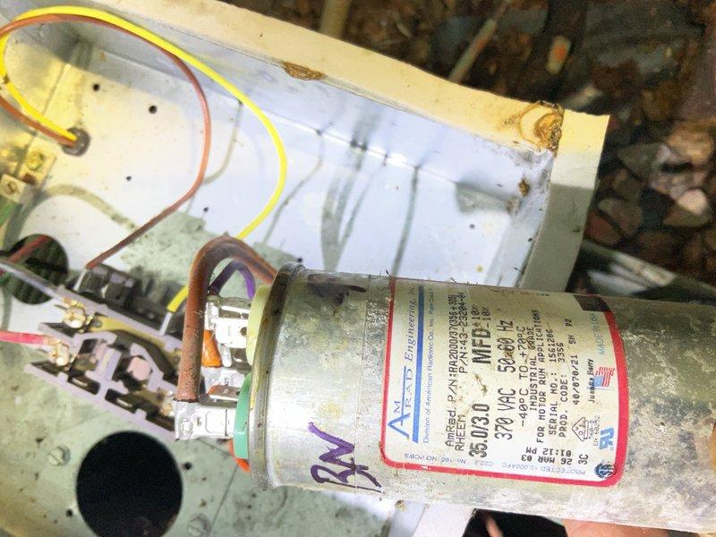 Responded to no cooling complaint on 20-year-old air conditioning system. Upon arrival, diagnosed failed original capacitor from 2002 causing condenser fan motor failure. Replaced defective capacitor with new unit and performed condenser coil cleaning to improve airflow and heat transfer. System tested and restored to operational status. Due to advanced age and overall deteriorated condition of equipment, recommended obtaining replacement quote for homeowner's consideration, though customer elected to defer replacement at this time.