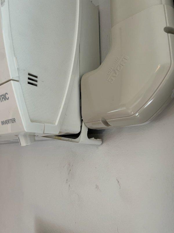 Replaced failed condensate pump on mini-split head and cleared plugged drain line from evaporator to pump reservoir. Verified proper drainage operation through multiple test cycles and confirmed all three mini-split heads are functioning correctly. Additionally secured loose corner trim piece on secondary head unit.