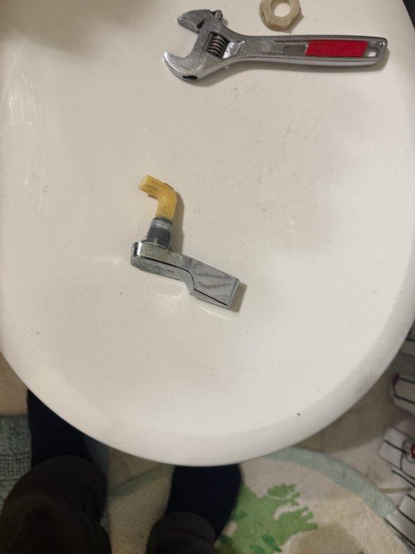 Responded to commercial toilet service call for non-functional flush handle. Upon inspection, found the trip lever mechanism inside the tank had failed, preventing proper toilet operation. Removed tank lid, assessed internal components, and successfully replaced the broken trip lever assembly with new hardware. Tested flush mechanism to ensure proper operation and restored toilet to full working condition.
