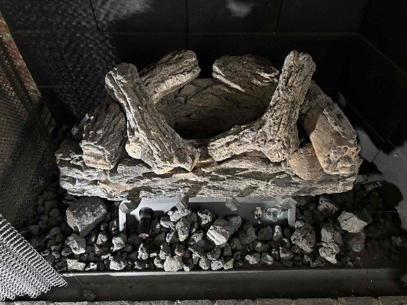 Completed maintenance on two gas fireplaces under maintenance agreement. Inspected pilot assemblies, decorative log sets, wiring, gas valves, and venting systems on both units—all components found to be in proper working order. Both fireplaces were operating without glass panels or ember beds at time of service. Unable to complete combustion safety analysis and CO level testing due to lack of available combustion analyzer equipment. Submitted follow-up work order for return visit to perform required safety checks and carbon monoxide measurements to ensure complete compliance with maintenance standards.
