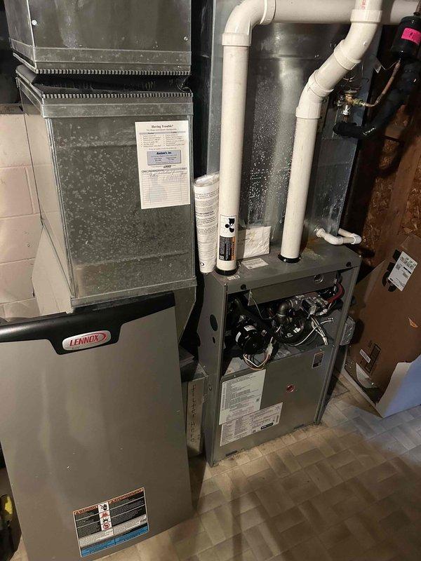Completed comprehensive furnace tune-up and maintenance inspection on Lennox heating unit as part of recurring preventive maintenance agreement. Performed standard system diagnostics, verified proper operation of blower motor and internal components, inspected condensate drainage system and PVC piping for proper function, and documented equipment condition with photographic records showing accessible components and system configuration.