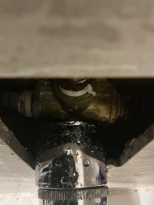 Responded to leaking shower valve located in exterior wall. Upon inspection, discovered valve stem had broken off at pipe connection inside wall cavity. Due to location and lack of access panel, determined that tile removal would be required for proper valve replacement. As temporary solution to restore water service to residence, cut and capped supply lines feeding the shower fixture. Water supply to remainder of home successfully restored. Homeowner opted to defer permanent shower valve repair and schedule comprehensive bathroom remodel estimate to address shower system and surrounding tile work.