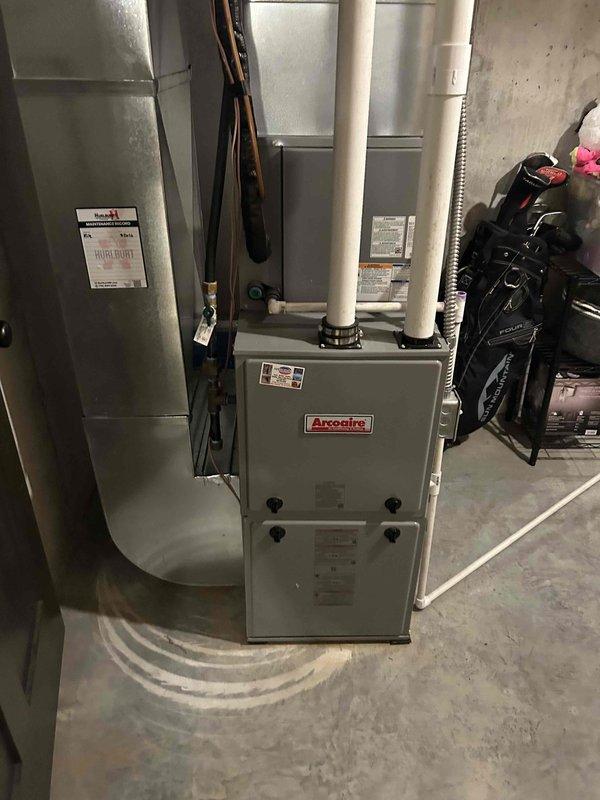 Responded to residential HVAC system experiencing cooling issues. Diagnosed low refrigerant charge and failing capacitor as primary concerns. Replaced dual run capacitor with new 35/5 MFD unit and restored proper electrical operation to compressor and condenser fan motor. Added approximately one pound of R410A refrigerant to system, monitoring subcooling temperature to achieve target range of 10°F ±3°F. Final subcooling measurement stabilized at 12°F, confirming proper refrigerant charge. Verified system operation with air conditioning cooling effectively and all components functioning within normal parameters.