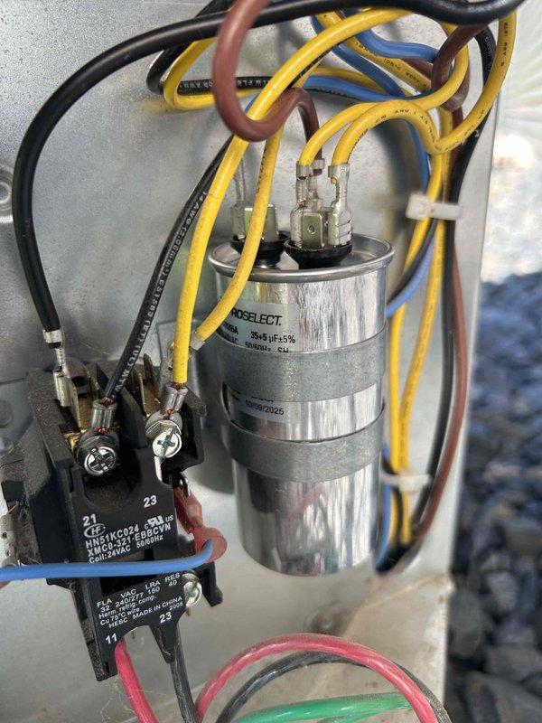 Responded to residential HVAC system experiencing cooling issues. Diagnosed low refrigerant charge and failing capacitor as primary concerns. Replaced dual run capacitor with new 35/5 MFD unit and restored proper electrical operation to compressor and condenser fan motor. Added approximately one pound of R410A refrigerant to system, monitoring subcooling temperature to achieve target range of 10°F ±3°F. Final subcooling measurement stabilized at 12°F, confirming proper refrigerant charge. Verified system operation with air conditioning cooling effectively and all components functioning within normal parameters.