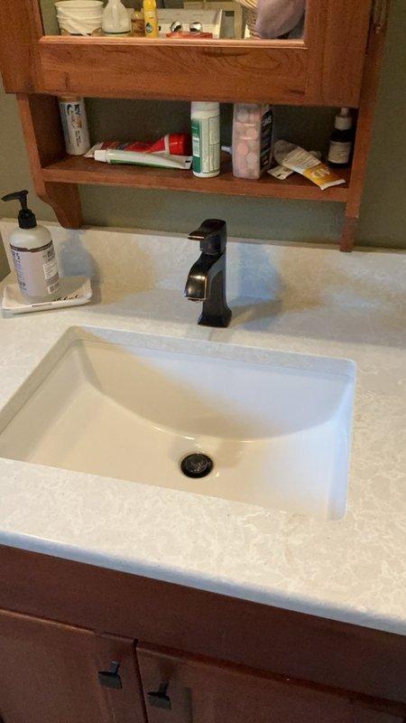 Completed comprehensive plumbing inspection of residential property including basement utility area and bathroom fixtures. Inspected water treatment system, pressure tank connections, supply lines, and drainage systems throughout the home. All plumbing fixtures, faucets, and visible piping were examined and found to be in proper working order with no leaks or deficiencies noted at time of inspection.
