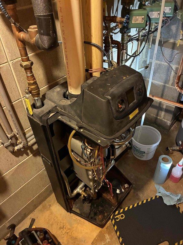 Completed comprehensive boiler preventive maintenance and tune-up service. During inspection, discovered a slightly warped venturi causing minor gas leakage when cold; the component expands when heated, temporarily sealing the leak. Recommended maintenance kit installation as previous service history indicated overdue maintenance. Thoroughly inspected and verified proper operation of circulator pumps, expansion tank, and all associated system components. Documented findings with photos, initiated part order form for repair pricing, and coordinated advisor consultation for replacement system options.