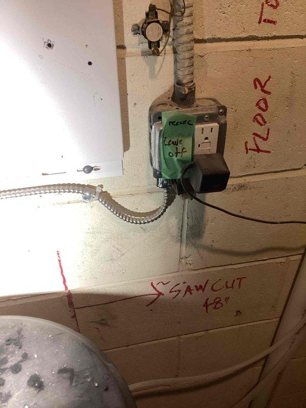 Disconnected and drained electric boiler system in preparation for HVAC installation and concrete cutting work. Shut down boiler, labeled all piping connections, and systematically disconnected water lines using SharkBite fittings to maintain assembly integrity. Removed boiler unit from wall mounting and relocated to floor area near furnace to clear workspace for structural modifications. Entire assembly was removed as a single piece to preserve system components for potential reinstallation or disposal.