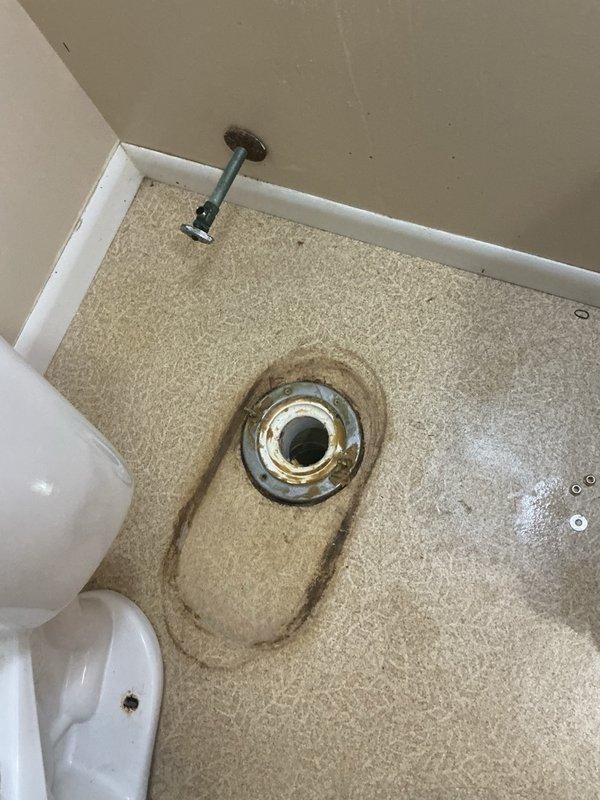 Responded to main floor toilet leaking into basement upon flushing. Removed and reset toilet after confirming failed wax seal. Discovered toilet drain line extremely backed up due to reported frequent flushing of wipes. Attempted to clear blockage but obstruction proved too severe for standard augering equipment. Installed new wax ring and reinstalled toilet to stop active leak. Coordinated same-day follow-up visit with drain specialist equipped with appropriate tools to clear stubborn blockage in main drain line.