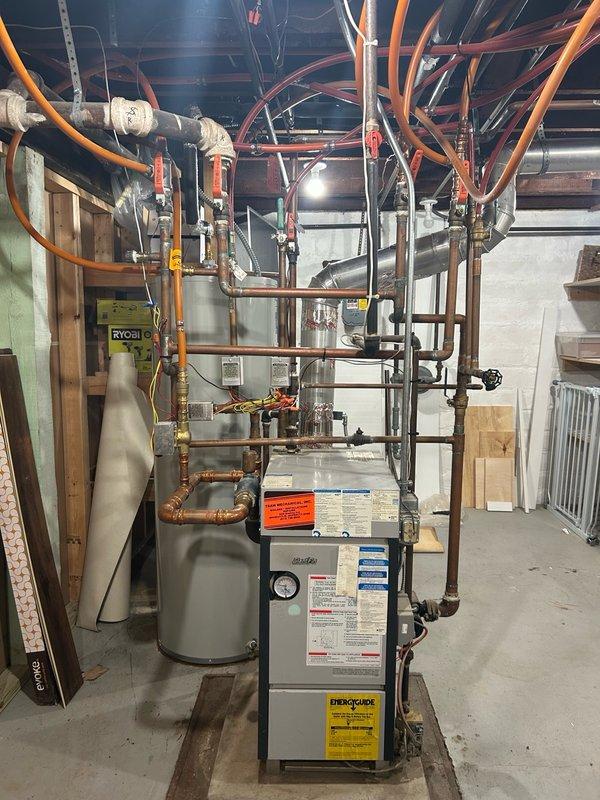 Performed comprehensive boiler tune-up and preventative maintenance inspection as part of scheduled heating system service. Conducted thorough evaluation of thermostat operation, water pressure levels, blower assembly, burner and heat exchanger compartment, inducer motor operation, ignition system components, flame igniter functionality, safety controls, and all electrical components. Tested carbon monoxide levels and measured temperature rise across the system. All operational readings and measurements were within manufacturer specifications and normal operating parameters. No mechanical deficiencies, safety concerns, or system abnormalities were identified during the inspection. System verified to be operating properly and efficiently at time of service completion.