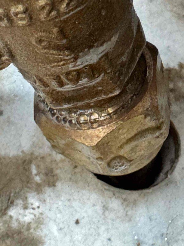 Responded to report of strong gas odor near dryer and immediately shut off gas supply as a safety precaution. Inspected gas piping to dryer and identified active leak at corroded copper fitting connection. Disconnected the faulty fitting, cleaned the connection surfaces, reassembled, and properly tightened to manufacturer specifications. Restored gas service and performed bubble test verification to confirm leak was successfully eliminated and system was safe for operation.