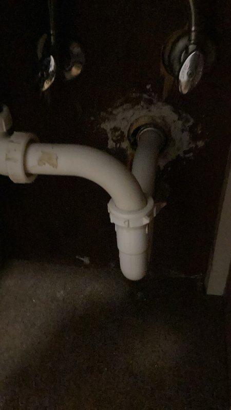 Responded to a slow-draining bathroom sink on the main floor. Inspected and found the P-trap clear of obstructions. Snaked the drain line from the fixture arm through to the three-inch stack to remove buildup causing the blockage. Provided estimate for services and successfully cleared the line, restoring proper drainage function.