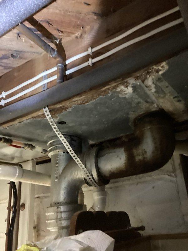 Responded to a slow-draining bathroom sink on the main floor. Inspected and found the P-trap clear of obstructions. Snaked the drain line from the fixture arm through to the three-inch stack to remove buildup causing the blockage. Provided estimate for services and successfully cleared the line, restoring proper drainage function.