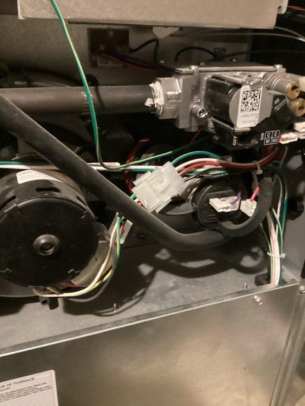 Responded to warranty call for system randomly switching from cooling to heating mode with hot air discharging from vents despite thermostat set to cool. Upon inspection, confirmed furnace was activating heating cycle during cooling calls and when system was off, with control board displaying "H" during malfunction episodes. Performed thorough diagnostic evaluation of thermostat settings, verified proper configuration, and inspected all associated wiring for damage or loose connections—no wiring issues identified. Determined faulty control board as root cause of erratic heating activation. Ordered replacement control board under warranty coverage. Equipment photographed for documentation. Will return upon parts arrival to complete installation and verify proper system operation.