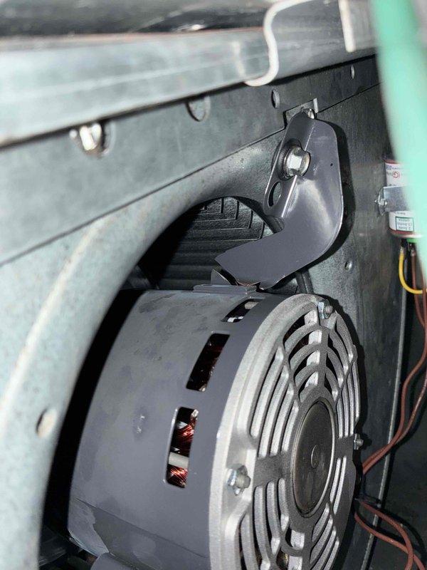 Responded to no cooling complaint on 20-year-old air handler unit. Upon inspection, discovered the welded blower motor mount had failed catastrophically, causing the blower wheel to break. This is a repeat failure of the same component that was replaced under warranty just months ago. Completed diagnostic assessment and documented failure with photographs showing the damaged blower assembly, broken mounting bracket, and surrounding refrigerant lines with visible condensation. Prepared parts order for replacement blower motor and blower wheel, specifying universal motor with belly band mounting system instead of OEM welded bracket design to prevent future failures. Unit currently non-operational pending parts arrival and installation under warranty coverage.