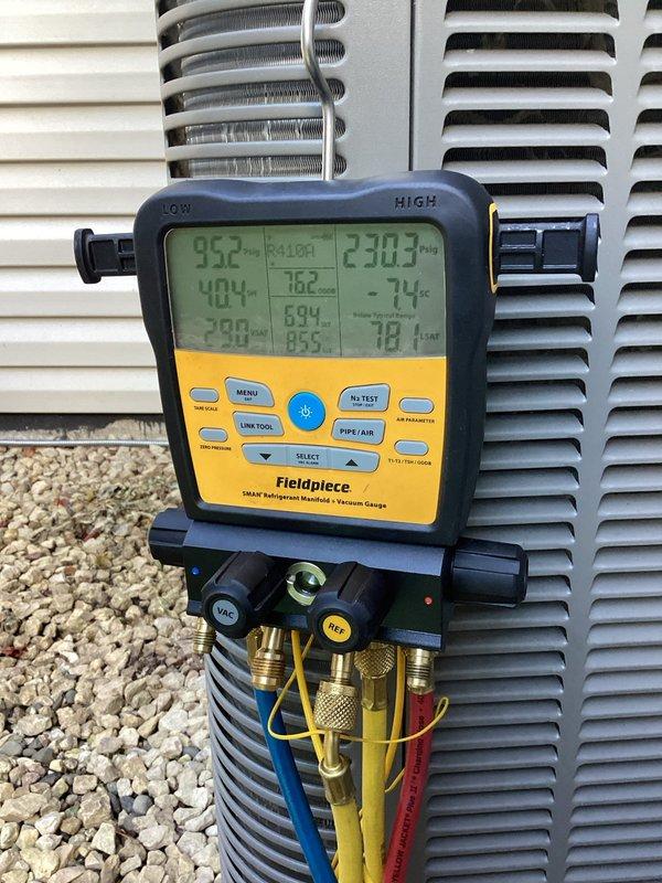 Responded to service call for routine AC maintenance and reported basement water leakage issue. Upon arrival, performed comprehensive inspection of 6-year-old system including condenser unit and basement A-coil assembly. Verified condensate drain line was clear and flowing properly. Inspected A-coil drain pan and noted rust present but confirmed no bottom leakage, indicating pan structural integrity remained intact.

Conducted temperature split analysis across the evaporator coil which revealed abnormally low temperature differential. Connected refrigerant manifold gauges to system and performed pressure diagnostics, confirming refrigerant charge was significantly low. Based on inspection findings and water accumulation pattern on top of furnace, determined leak was likely occurring at piston/metering device location outside of drain pan, causing refrigerant loss and resulting condensation to bypass pan collection system.

Re-sealed exterior seams of A-coil casing to prevent moisture m