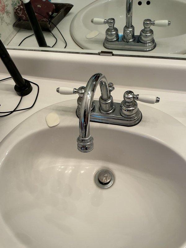 Responded to a water leak originating from an upstairs toilet that was leaking from the base and causing damage to the basement below. Removed and replaced the failed toilet with a new Gerber unit, ensuring proper wax ring seal and secure mounting to prevent future leaks. Additionally addressed two dripping bathroom vanity faucets by installing new Moen lavatory faucets with chrome finish and porcelain handles. All fixtures were tested for proper operation and verified leak-free upon completion.