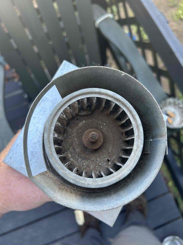 Responded to no-heat call on 20+ year-old natural gas furnace. Diagnosed locked inducer motor with proper voltage supply and heavily rusted squirrel cage blower wheel with significant debris accumulation. Replaced failed inducer motor assembly and installed new squirrel cage blower wheel to restore proper airflow and system operation.