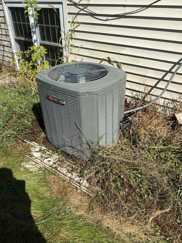 Completed comprehensive AC tune-up on Trane outdoor unit, performing electrical component inspection and full coil cleaning due to severely plugged condenser coils. Indoor furnace inspection was deferred at homeowner's request. Verified recent filter change with homeowner, tested system operation, and confirmed proper performance with 20-degree temperature split across the evaporator coil.