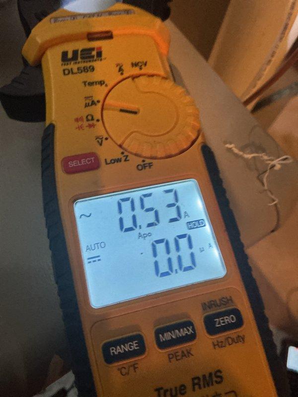 Completed scheduled maintenance on 10-year-old gas furnace system with humidifier under maintenance agreement. Performed standard inspection, filter service, and system diagnostics. During inspection, discovered evaporator coil assembly with significant frost and ice accumulation on fins and surfaces, indicating potential airflow restriction or refrigerant issue. Measured system amperage at 0.53A using digital multimeter to verify compressor performance. Documented coil condition with photos showing ice buildup on metallic fins and electrical connections. System currently operational but frost condition requires attention to prevent efficiency loss and potential component damage. Recommended follow-up service to address ice formation issue, which may involve checking airflow, refrigerant charge, or defrost controls.