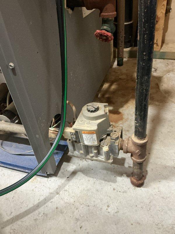 Performed comprehensive tune-up on 22-year-old boiler serving in-floor radiant heating system with glycol. During inspection, identified failing inducer draft motor and measured carbon monoxide spillage at 3 ppm from top of heat exchanger, which is within acceptable limits but indicates developing concern. Documented all findings with photographic evidence of gas valve assembly and pressure gauge readings. Provided detailed estimate for inducer draft motor replacement and complete system drain, fill, and glycol recharge. Scheduled follow-up appointment for new boiler replacement consultation due to age of equipment and developing mechanical issues.
