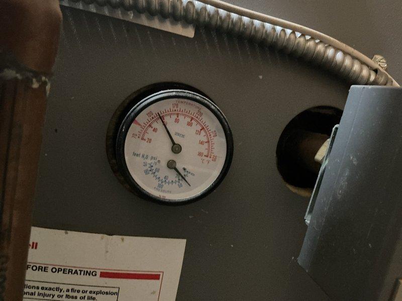 Performed comprehensive tune-up on 22-year-old boiler serving in-floor radiant heating system with glycol. During inspection, identified failing inducer draft motor and measured carbon monoxide spillage at 3 ppm from top of heat exchanger, which is within acceptable limits but indicates developing concern. Documented all findings with photographic evidence of gas valve assembly and pressure gauge readings. Provided detailed estimate for inducer draft motor replacement and complete system drain, fill, and glycol recharge. Scheduled follow-up appointment for new boiler replacement consultation due to age of equipment and developing mechanical issues.