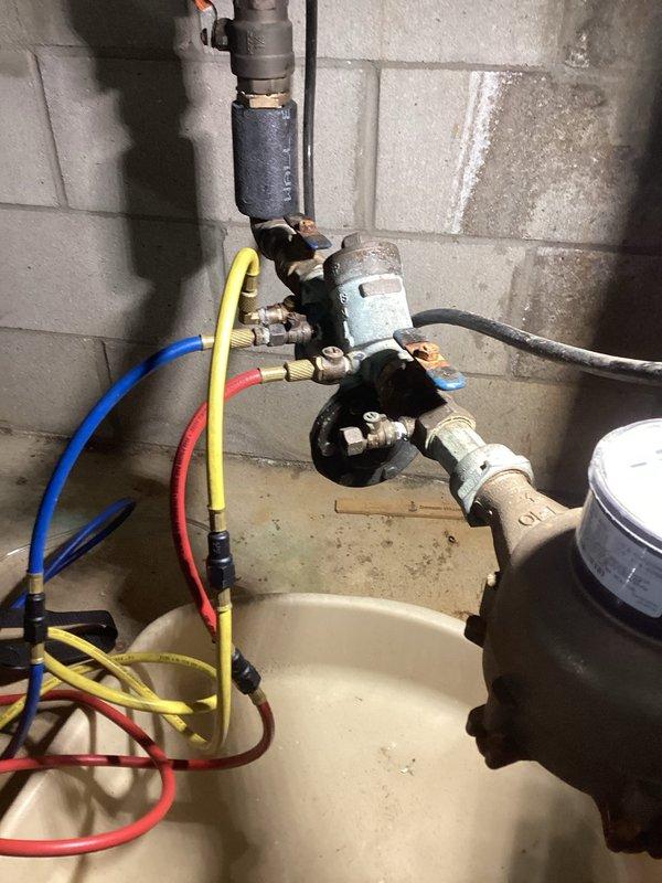 Completed backflow prevention testing on commercial property's RPZ device, which tested successfully and passed inspection. Evaluated non-functional water softener that had been shut off, resulting in solidified salt buildup within the brine tank. Recommended comfort advisor consultation for water softener replacement due to age and inoperability of existing unit.