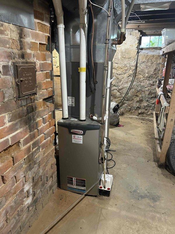 Completed comprehensive annual furnace tune-up and inspection on 12-year-old heating system per maintenance agreement protocol. Performed standard preventative maintenance checklist including burner inspection, heat exchanger examination, blower motor assessment, filter evaluation, and verification of proper venting through PVC intake and exhaust pipes. All components found operating within manufacturer specifications with no deficiencies noted at time of service.
