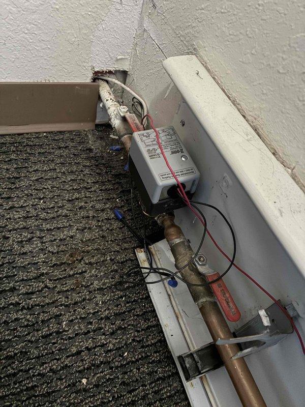 Responded to complaint of overheating condition in Room 4 with leaking heat register. Upon inspection, discovered zone valve actuator head had been dislodged from valve body, causing zone to remain in open position and allowing continuous water flow through heating loop. Reinstalled zone valve head onto body and secured properly. Cycled thermostat to verify proper zone valve operation and confirmed valve closed as designed. System restored to normal operation with zone responding correctly to thermostat calls.