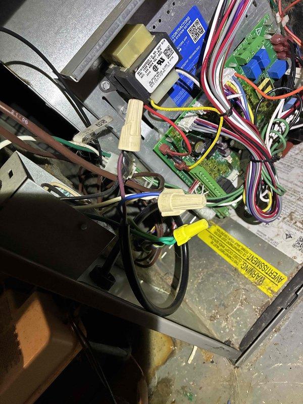 Responded to no cooling complaint on Ruud HVAC system less than 10 years old. Upon arrival, found red indicator light on furnace panel and outdoor unit fan not engaging. Diagnosed furnace running inducer motor only with no further operation. Connected to unit via mobile diagnostic interface and retrieved fault code indicating flame sense error without gas valve energization. Code returned immediately upon clearing, indicating persistent control issue. 

Inspection revealed missing ground wire connection at furnace. Temporarily connected ground to MC cable sheath to test if grounding issue was causing fault code, but error persisted, confirming control board failure as root cause. Verified all other electrical connections and wiring integrity within control panel. Documented control board part number and unit information for warranty verification and parts ordering. Submitted part order form for replacement control board with warranty status inquiry. 

Noted need for proper ground wire 