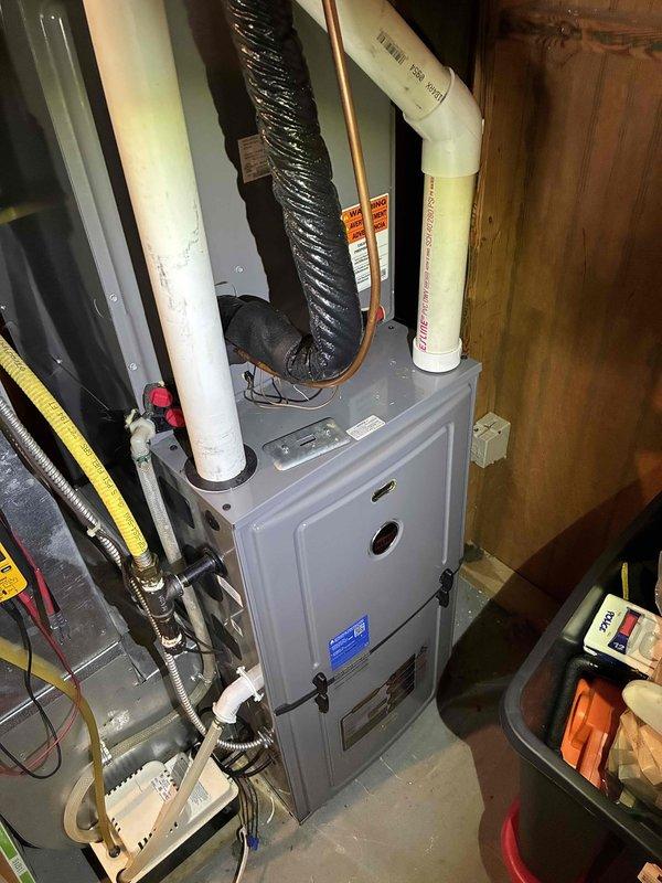 Responded to no cooling complaint on Ruud HVAC system less than 10 years old. Upon arrival, found red indicator light on furnace panel and outdoor unit fan not engaging. Diagnosed furnace running inducer motor only with no further operation. Connected to unit via mobile diagnostic interface and retrieved fault code indicating flame sense error without gas valve energization. Code returned immediately upon clearing, indicating persistent control issue. 

Inspection revealed missing ground wire connection at furnace. Temporarily connected ground to MC cable sheath to test if grounding issue was causing fault code, but error persisted, confirming control board failure as root cause. Verified all other electrical connections and wiring integrity within control panel. Documented control board part number and unit information for warranty verification and parts ordering. Submitted part order form for replacement control board with warranty status inquiry. 

Noted need for proper ground wire 