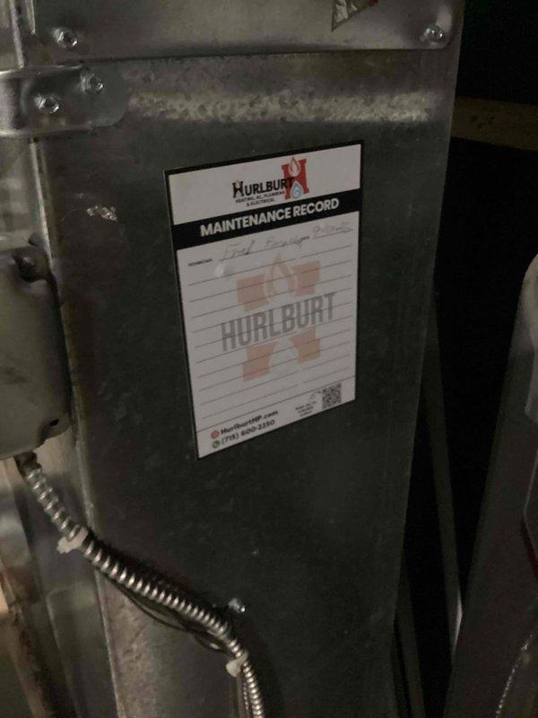 Completed routine maintenance and tune-up service on residential furnace and air conditioning system per maintenance agreement. Performed comprehensive inspection of HVAC equipment, verified thermostat operation showing 74°F setpoint with 43% humidity and proper scheduling function. Applied Hurlburt maintenance record label to equipment for service documentation and future reference tracking.