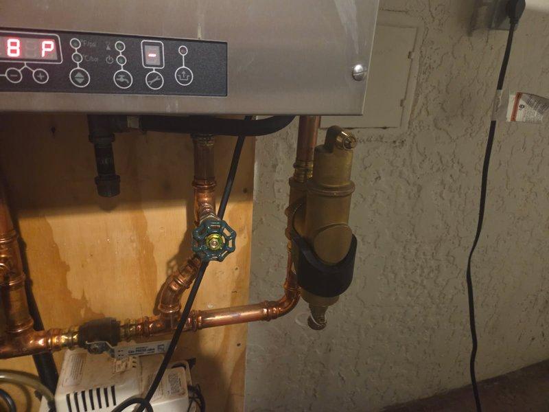 Responded to service call for IBC hot water boiler displaying low water pressure code and auto-fill malfunction. Upon arrival, confirmed system was experiencing low pressure and automatic fill valve was not functioning properly. Inspected and adjusted auto-fill valve to restore proper operation.

Performed comprehensive annual maintenance service on the boiler system. Disassembled and removed heat exchanger for thorough cleaning to remove scale buildup and ensure optimal heat transfer efficiency. Cleaned burner assembly and combustion chamber. Reassembled heat exchanger and verified all connections were properly secured.

Conducted full electrical system inspection, checking all control components, safety devices, and wiring connections. Verified proper operation of control board, circulator pump, and zone valves. Tested all safety switches and limit controls for proper functionality.

Started boiler and monitored through complete heating cycle. Verified system reached proper operating
